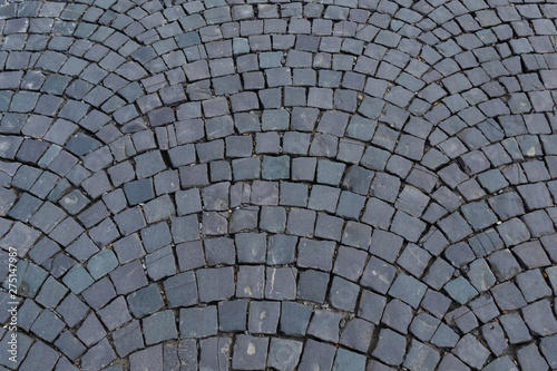 Granite paving stone of various shades of gray. Background.