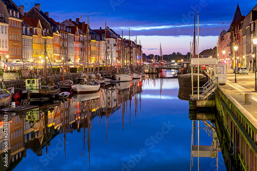 Copenhagen. Nyhavn Canal, colorful houses and city embankment at sunrise.