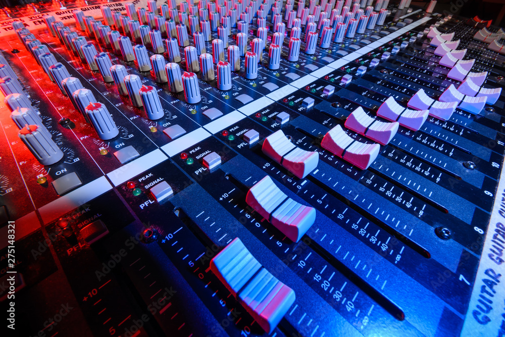 Fototapeta premium detail sound mixer in red and blue light with great perspective