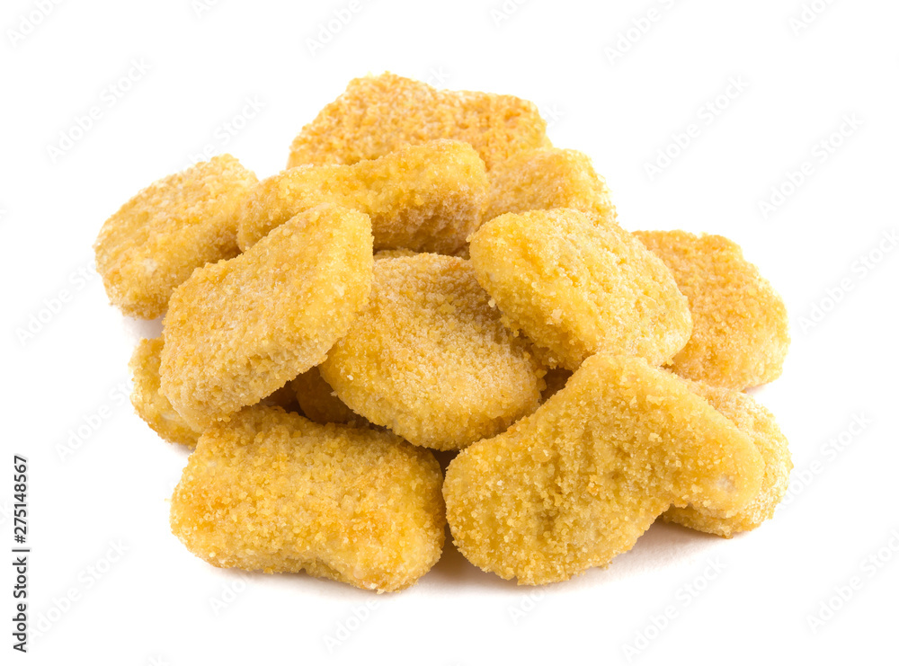 Frozen nuggets on a white background. Several chicken nuggets in breading close-up on a white background. Frozen nuggets on a white background. Several chicken nuggets in breading close-up on a white background.