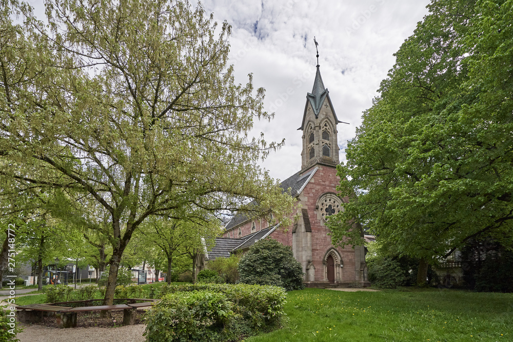 Beautiful flowering tree next to the Evangelical Church in the European city of Baden Baden, Germany Beautiful flowering tree next to the Evangelical Church in the European city of Baden Baden, Germany