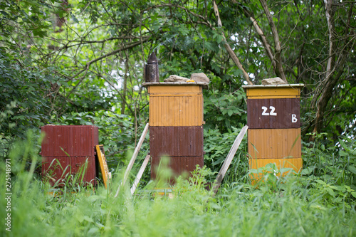 beehive, bees entering the hive. Beekeeping and honey collection