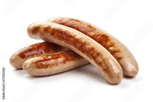 Grilled German pork sausages, Thuringer Rostbratwurst, close-up, isolated on white background photo
