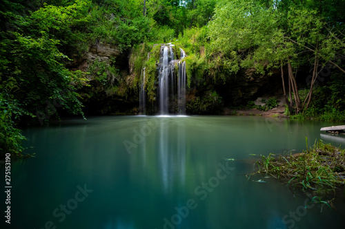 Canvas Print Waterfall and a beautiful lagoon lake for relaxing in the summer forest