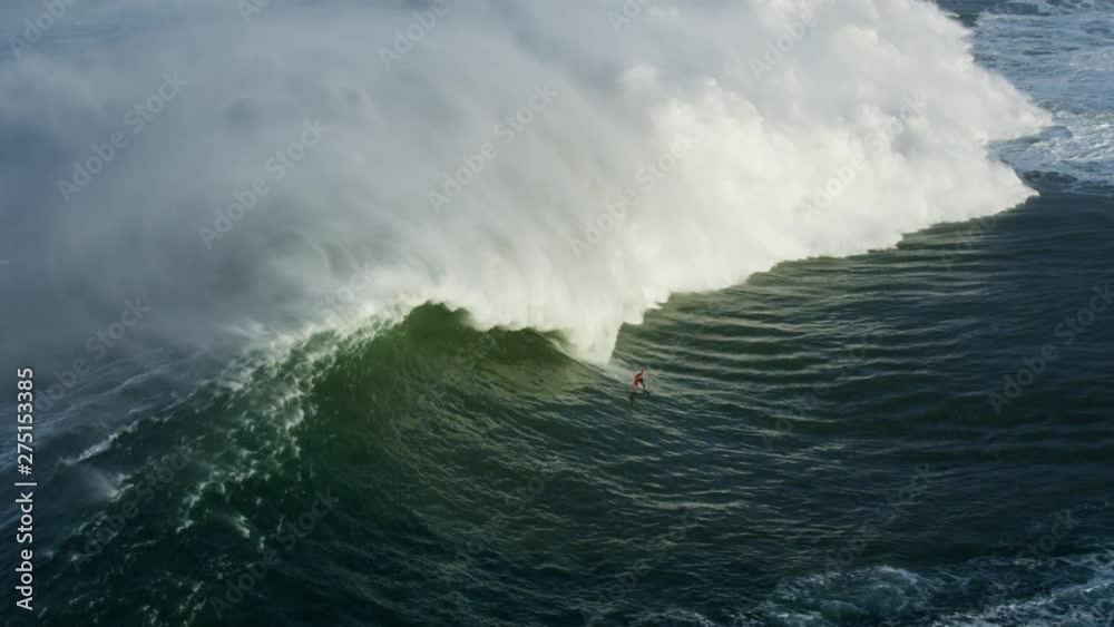 Aerial surfer riding wave Half Moon Bay Mavericks