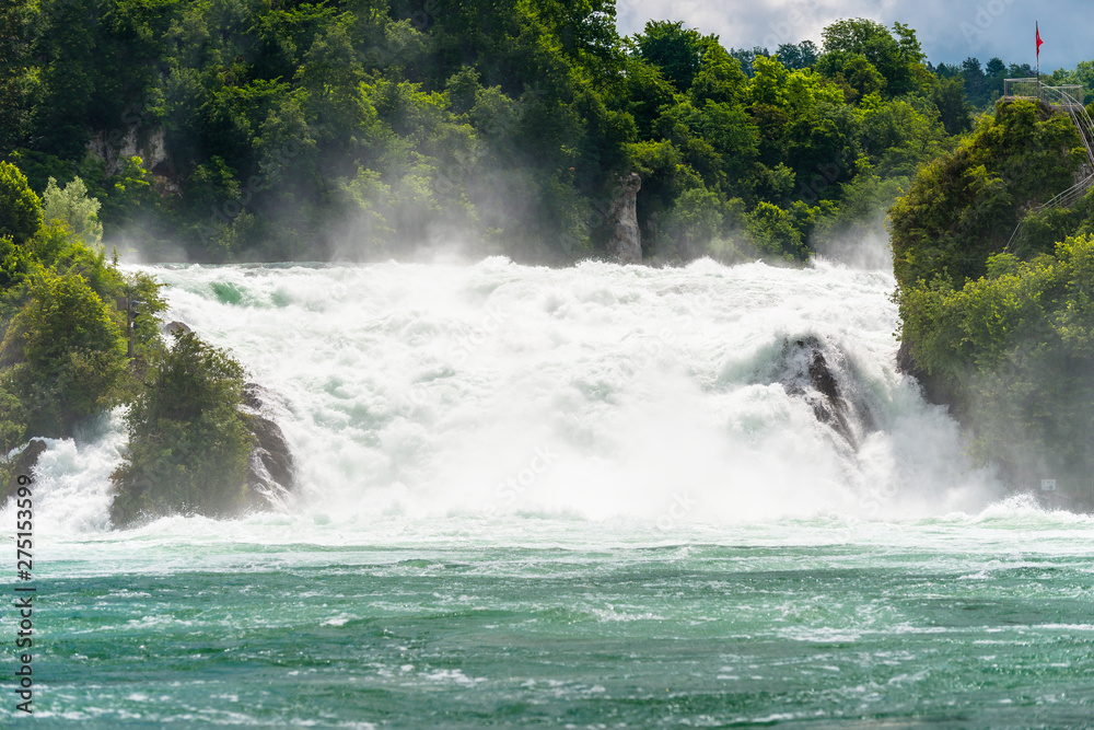 A beautiful waterfall on the river Rhine in the city Neuhausen am Rheinfall in northern Switzerland. The Rhine Falls is the largest waterfall in Europe.