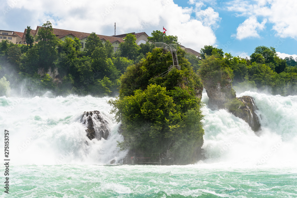 A beautiful waterfall on the river Rhine in the city Neuhausen am Rheinfall in northern Switzerland. The Rhine Falls is the largest waterfall in Europe.