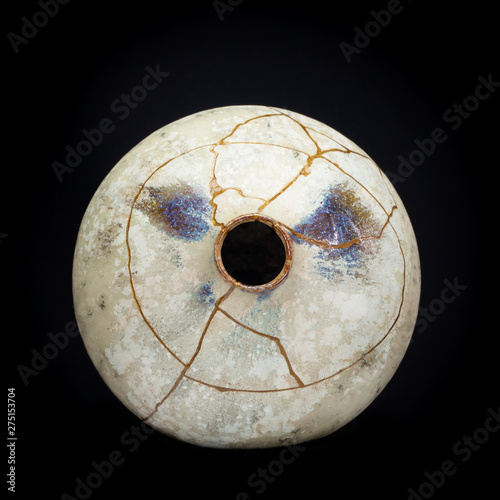 A head on shot of a vase I repaired with gold powder and urushi lacquer.