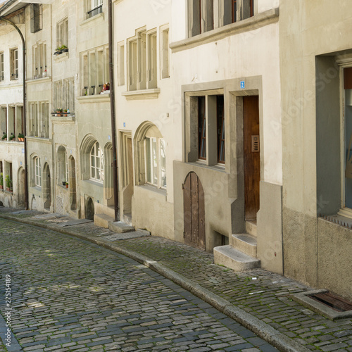 histoirc cobblestone streets and buildings in the old town of the Swiss city of Fribourg photo