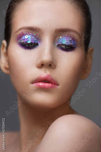 Art makeup many sequins and rhinestones of different shapes