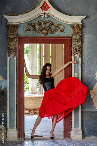 Young woman in red dress in old room © pucko_ns
