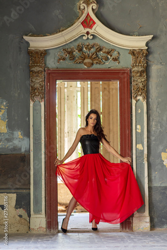 Young woman in red dress in old room © pucko_ns