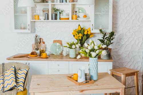 Kitchen utensils, concept of home decor kitchen decorated with flowers, front view