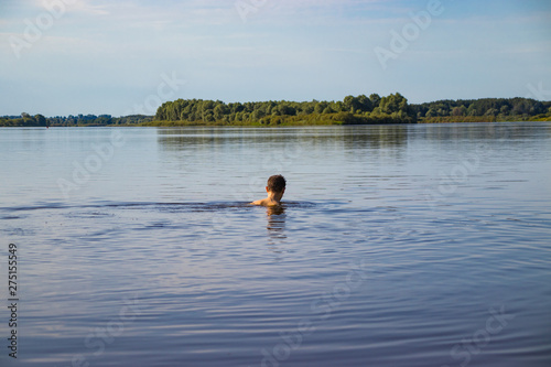 A person leads a healthy lifestyle and swims in the river