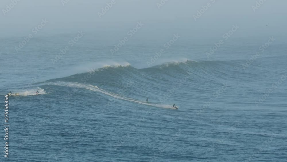 Aerial surfers on extreme surf competition Mavericks America