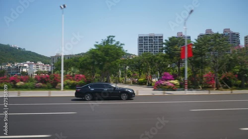 sunny day sanya city road trip traffic street side view pov panorama 4k hainan china