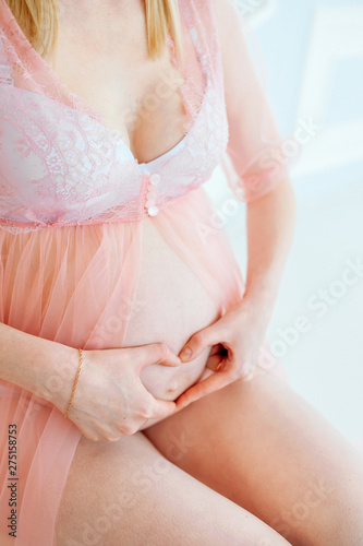Pregnant Woman Belly. Pregnancy Concept. Isolated on Black Background. Pregnant tummy close up