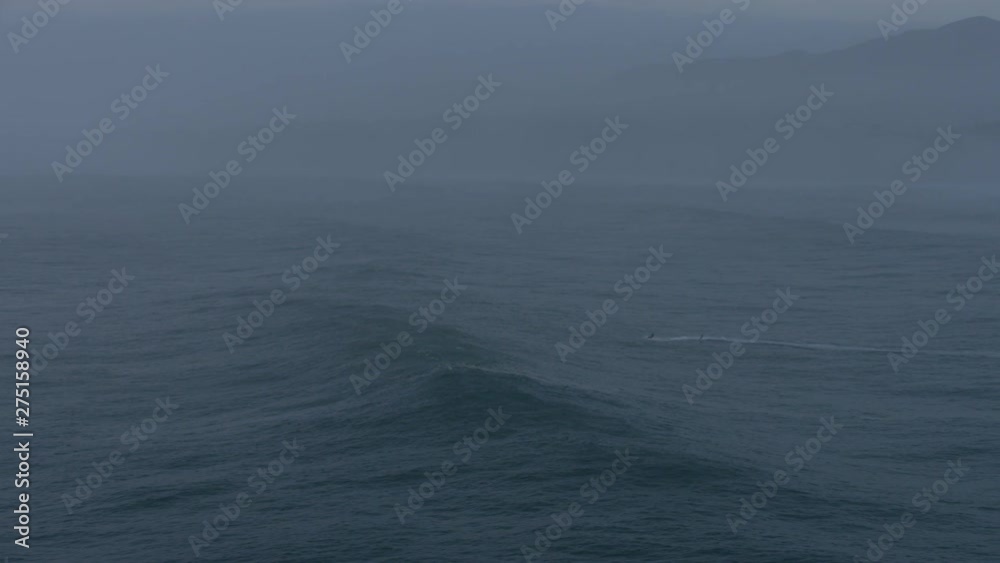 Aerial surfers on surface Pacific Ocean Mavericks America Aerial surfers on surface Pacific Ocean Mavericks America