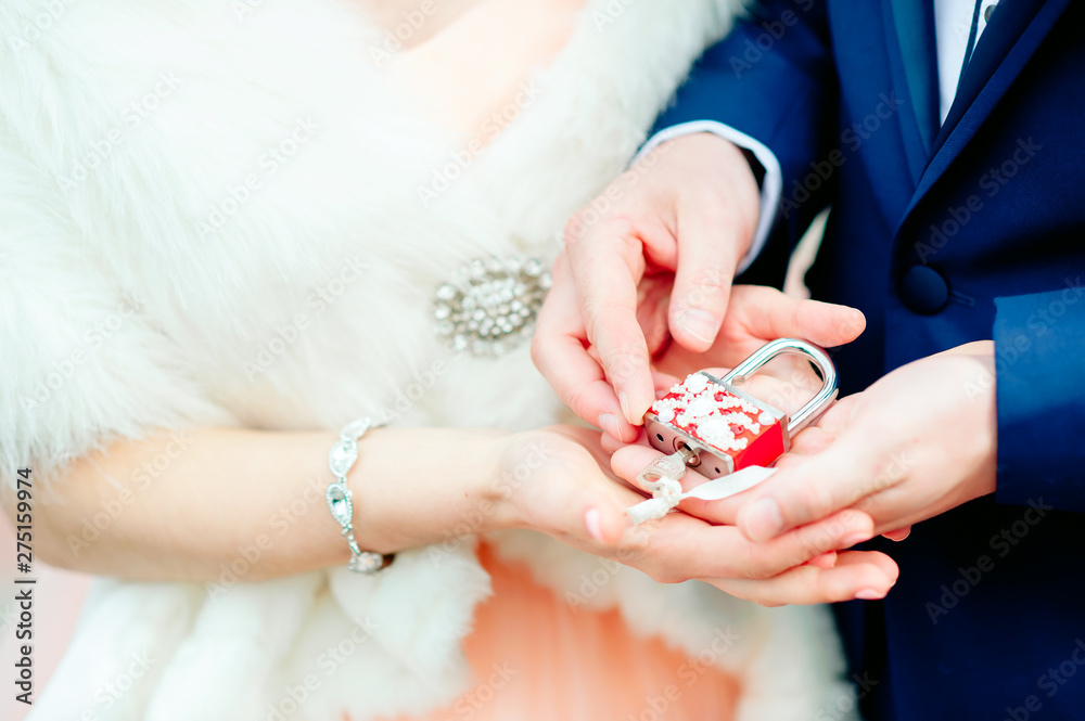 Hands of young couple in love close side by side on the first date. Loving couple has a happy relationships. First love concept. Hands of young couple in love close side by side on the first date. Loving couple has a happy relationships. First love concept.