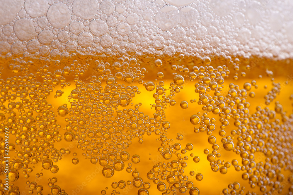 Pouring beer with bubble froth in glass for background Pouring beer with bubble froth in glass for background