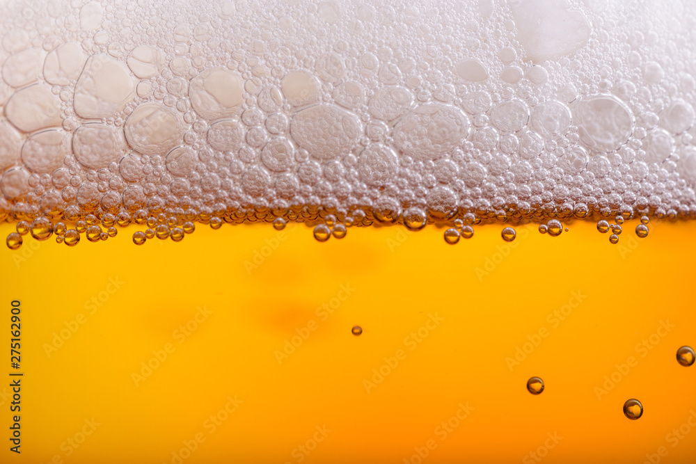 Pouring beer with bubble froth in glass for background Pouring beer with bubble froth in glass for background