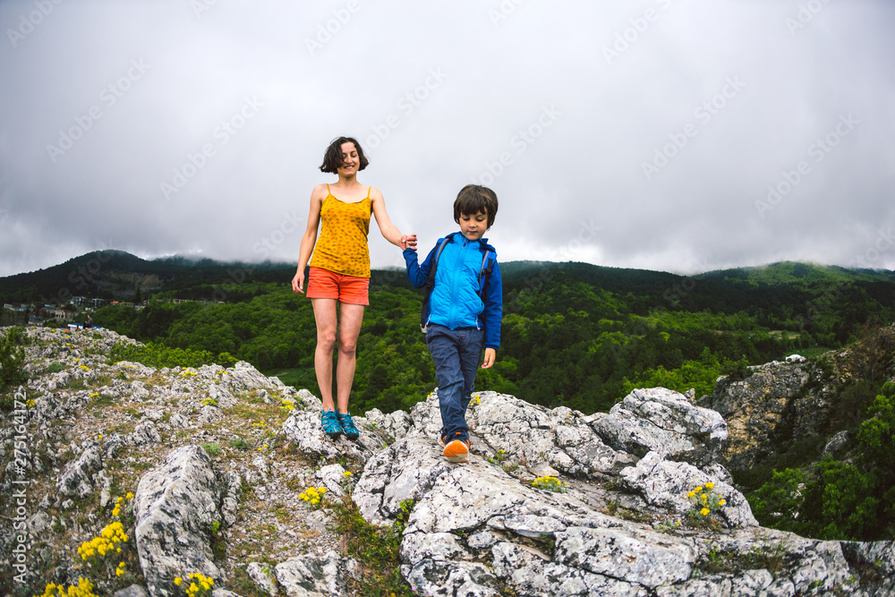 The boy with his mother on top of the mountain. The boy with his mother on top of the mountain.
