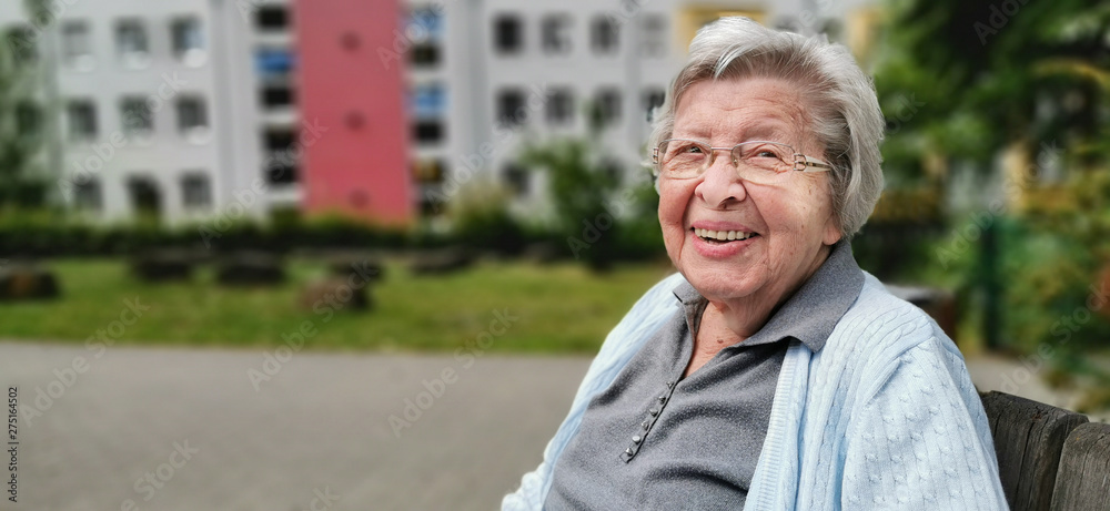 Senior Woman in Front of Residence Senior Woman in Front of Residence