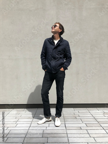 man standing waiting sunny day