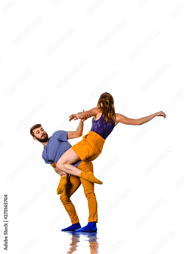 Couple of young hip-hop dancers training in studio