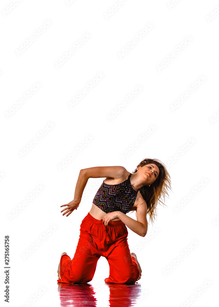 Beautiful dance pose of a young woman dancer with fluttering hair Beautiful dance pose of a young woman dancer with fluttering hair