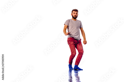 Adorable man dancing isolated on white background © qunica.com