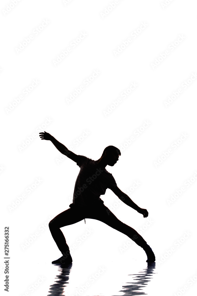 Man is dancing in the studio on a white background