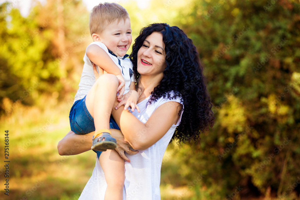 Portrait of happy mother and son smiling