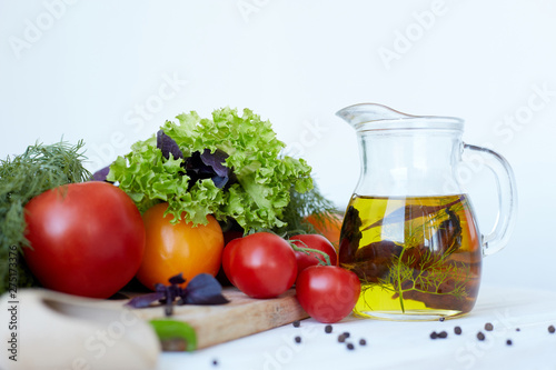 Composition with vegetables and spices on a table on a white background