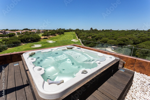 Jacuzzi bath with hydromassage on the roof of the villa. photo