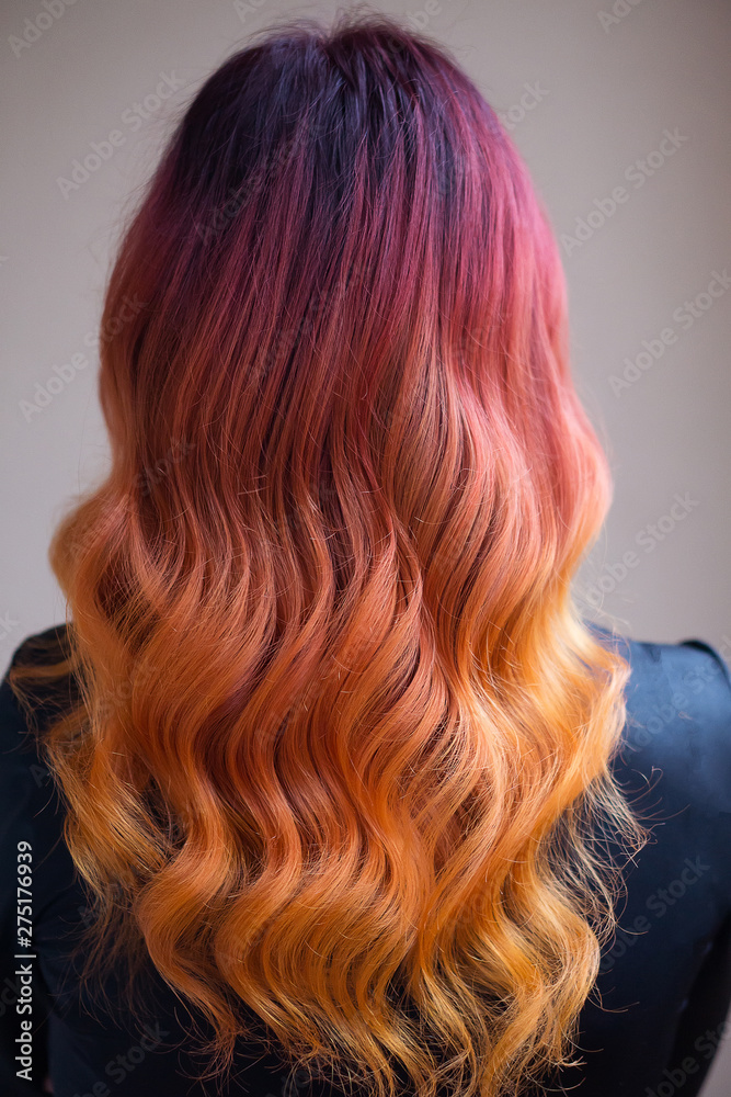 © Red Frog Photo - Woman with bright color dyed long curly hair © Red Frog Photo - Woman with bright color dyed long curly hair