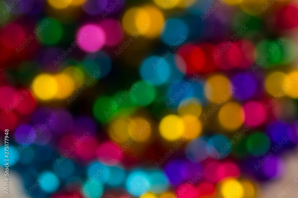 blurred bokeh bright multicolored iridescent glowing gold dimming beads spread on the table background blurred bokeh bright multicolored iridescent glowing gold dimming beads spread on the table background