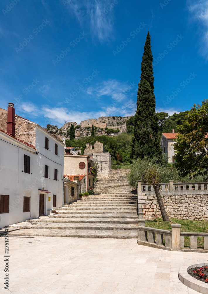 Church and square with fortress on hilltop in the coastal town of Novigrad in Croatia Church and square with fortress on hilltop in the coastal town of Novigrad in Croatia