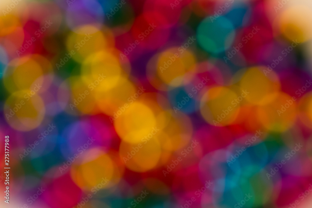 blurred bokeh bright multicolored iridescent glowing gold dimming beads spread on the table background blurred bokeh bright multicolored iridescent glowing gold dimming beads spread on the table background