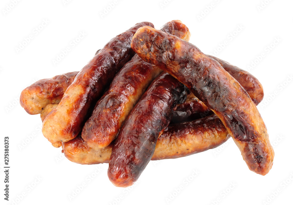 Group of grilled chipolata sausages isolated on a white background