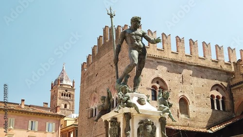 SLOW MOTION: Neptune 1567 bronze statue and fountain in front of Accursio palace of Bologna city in Emilia region of Italy.
