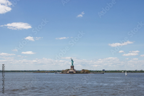 Statue of Liberty in New York. Bay in New York with the Statue of Liberty on a sunny summer day. USA, New York