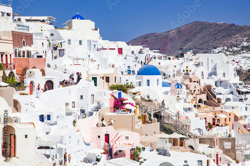 traditional blue doomed churches and white houses in Santorini, Cyclades islands Greece - amazing travel destination