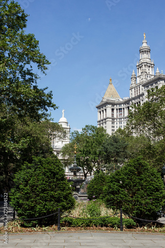 A park with a fountain near a Municipal Building in New York. Square in the big city on a summer day