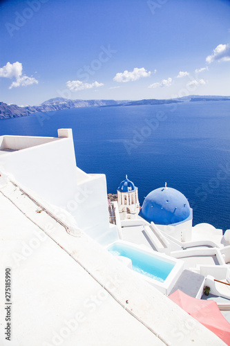 traditional blue doomed churches and white houses in Santorini, Cyclades islands Greece - amazing travel destination