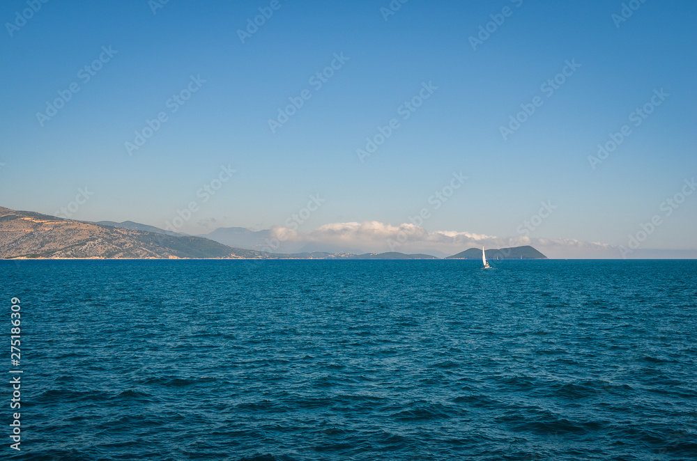Scenic view of mediteranean sea and sailing boat  against sky  in Corfu,  Greece