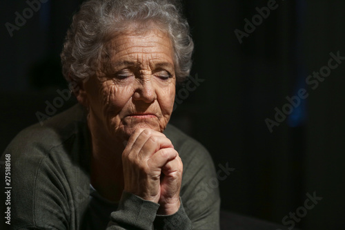 Senior woman praying to God...