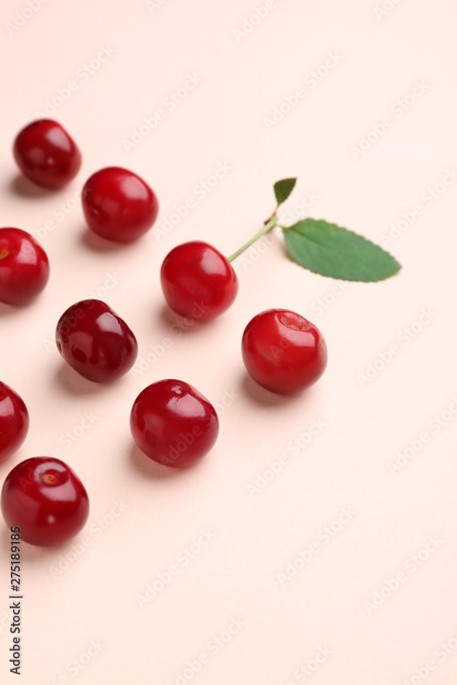Tasty ripe cherry on color background Tasty ripe cherry on color background
