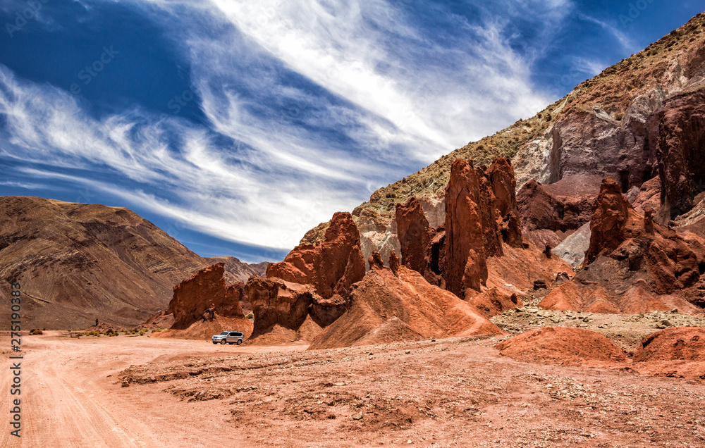San Pedro de Atacama, Chile - January 18, 2016: The Arco Iris Valley is part of the tour options for those who visit the Atacama, with beautiful landscape with rocks and cliffs of varied coloration.
