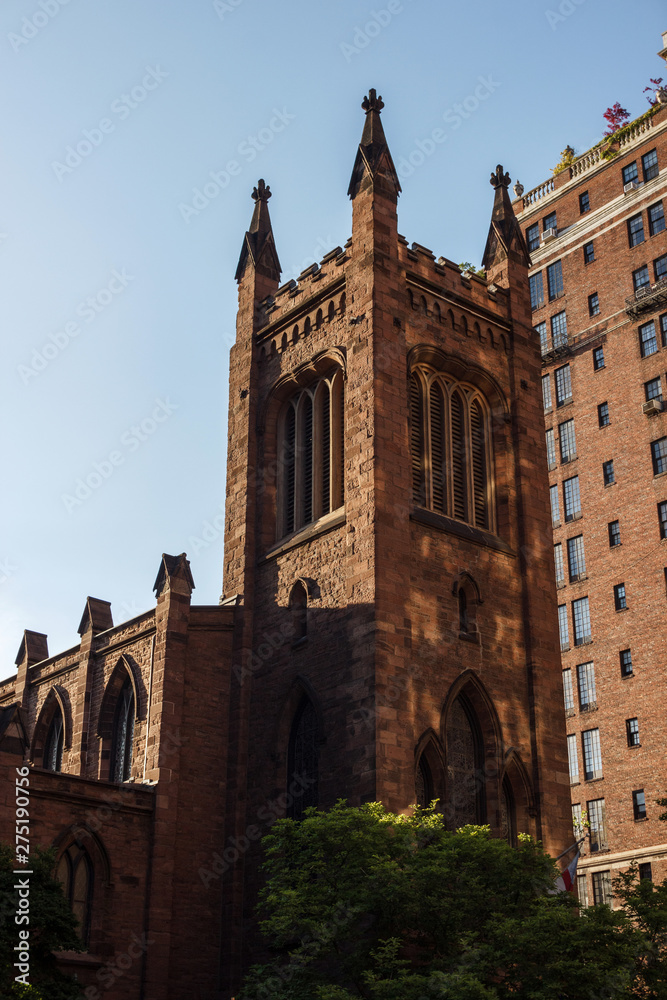 New York, NY / USA - May/27/2019: Church in the center of New York. Church on a background of blue sky.